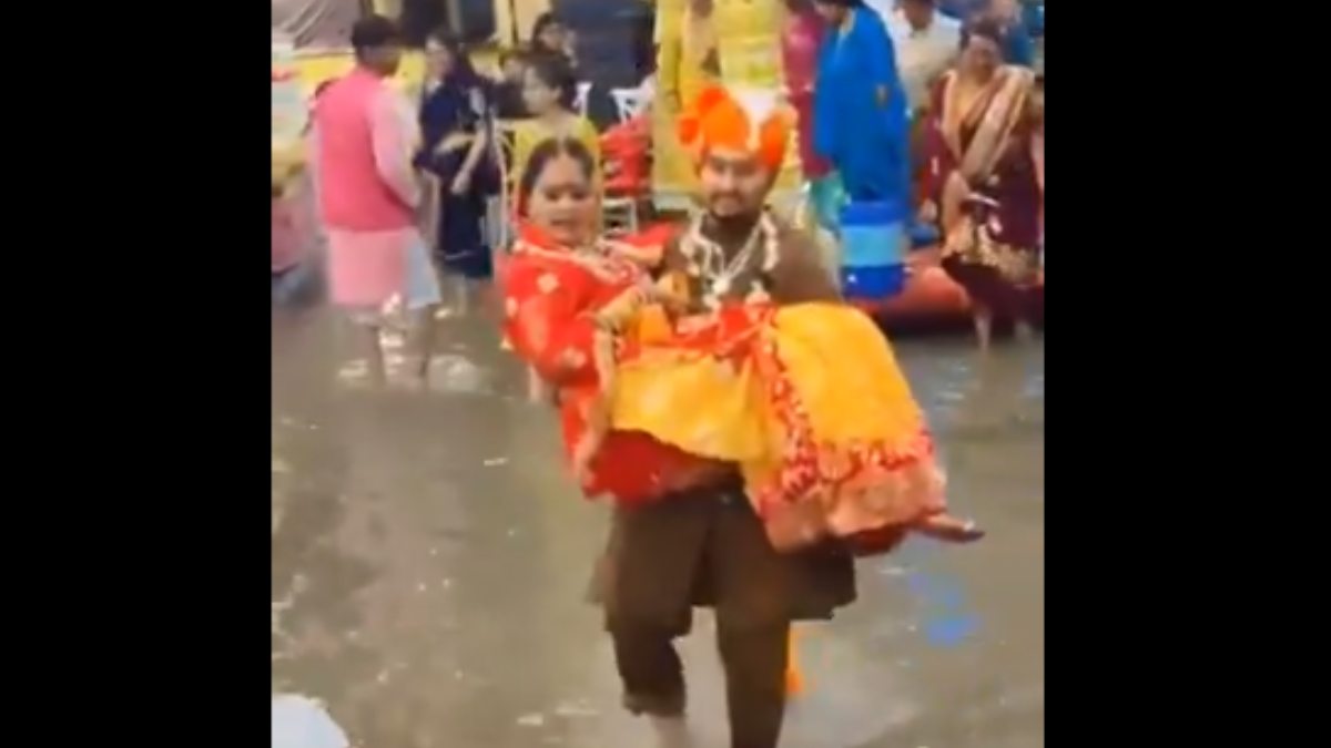 Floodwaters Disrupt Wedding Ceremony; Groom Carries Bride to Safety in Heartwarming Moment