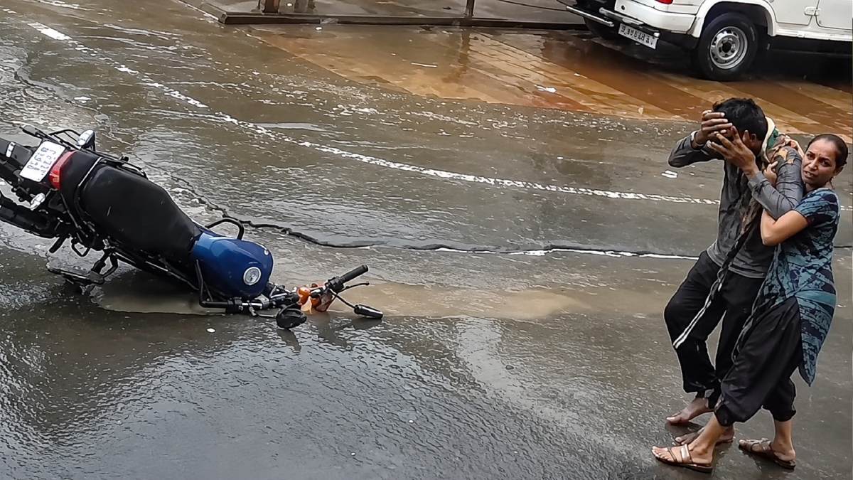 CCTV Captures Woman, Biker Falling Into Open Drain in Gujarat's Junagadh After Rain Sparks Safety Concerns