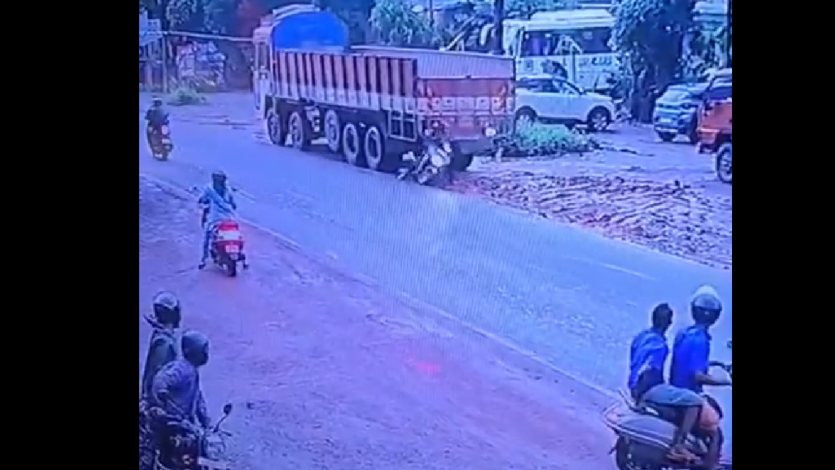 Scooter Rider Narrowly Escapes After Close Call with Heavy Commercial Vehicle in Kerala