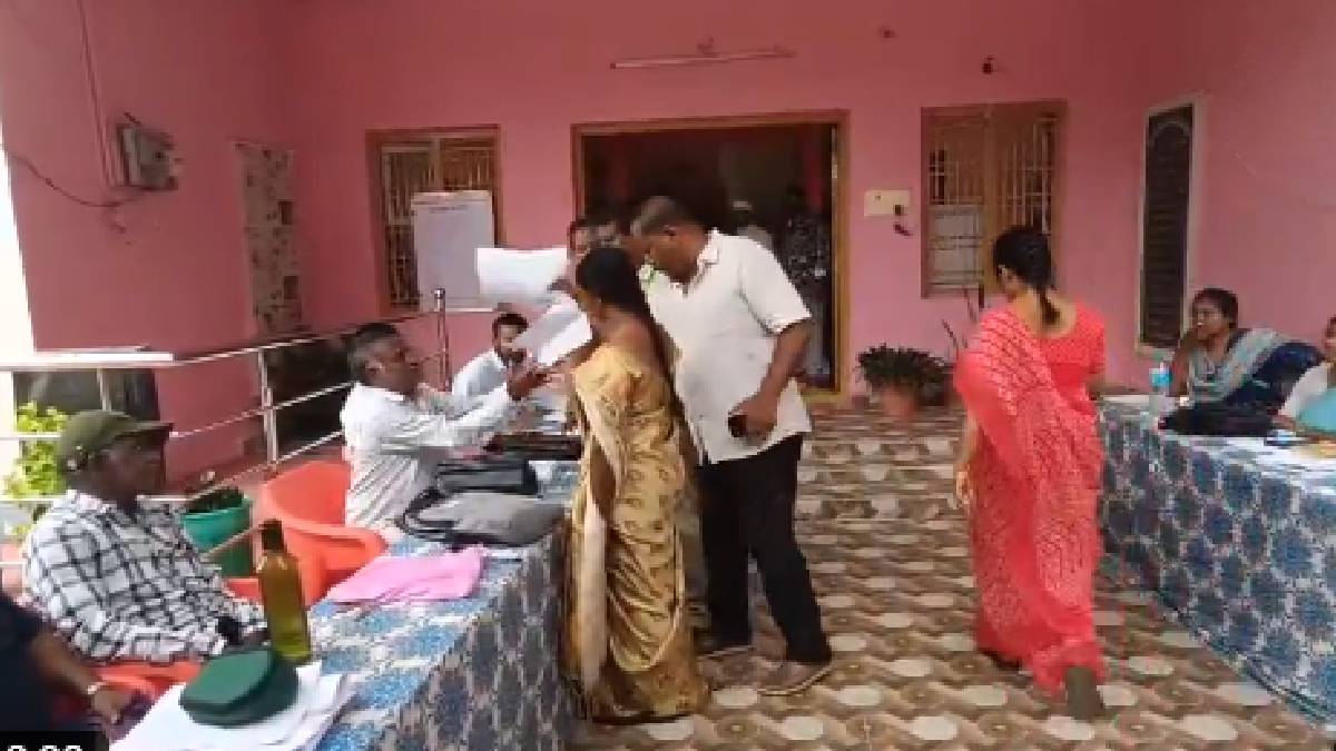 •  A protester forcibly snatching nomination papers from an official at an Andhra Pradesh municipal election center during local body poll clashes.
