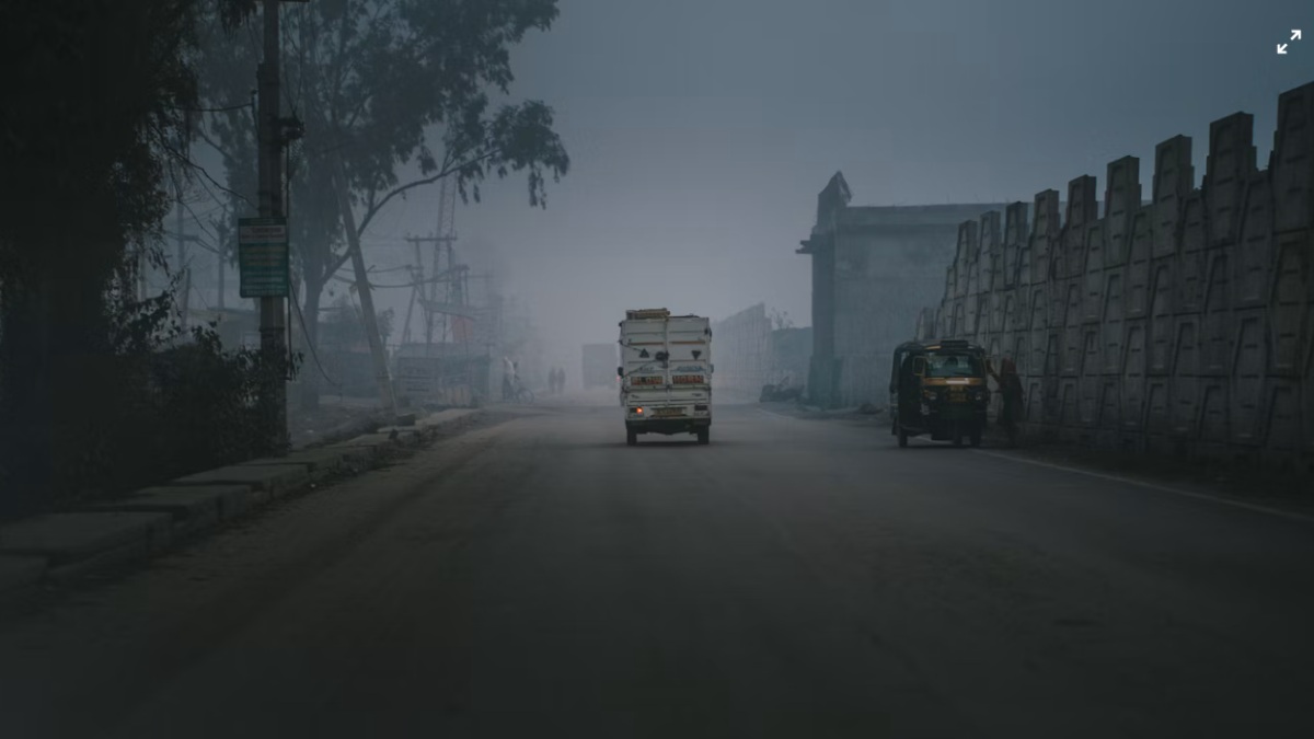 Rain-soaked streets in Delhi as temperatures fall to a 75-year October low and air quality improves.