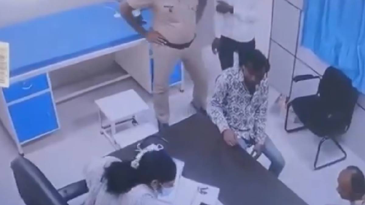 The accused sitting at the clinic, captured on camera